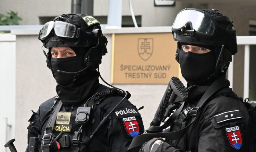 Armed police outside the court in Pezinok. Pic: AP