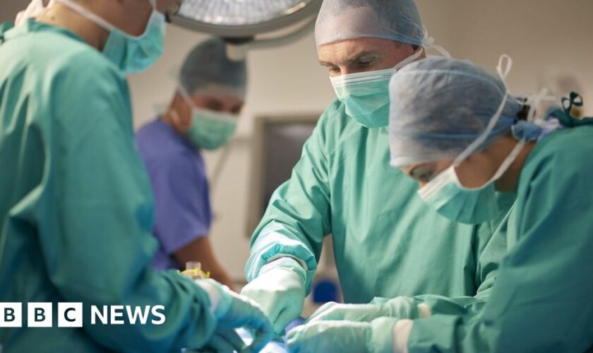 Hospital staff performing surgery