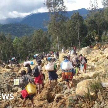 Race to rescue villagers trapped after landslide