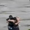 Friends seen in 'final embrace' before being swept away by flood