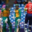 South Africa's Reeza Hendricks, left, and batting partner Quinton de Kock stand between the wickets during the ICC Men's T20 World Cup cricket match between England and South Africa at Darren Sammy National Cricket Stadium in Gros Islet, Saint Lucia, Friday, June 21, 2024. (AP Photo/Ramon Espinosa)