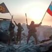 FILE - In this image from video provided by Prigozhin Press Service on Saturday, May 20, 2023, Yevgeny Prigozhin's Wagner Group military company members wave a Russian national and Wagner flag atop a damaged building in Bakhmut, Ukraine. Yevgeny Prigozhin's armed revolt against Russia's military leadership posed the greatest challenge to Vladimir Putin's authorities in his 23-year rule. (Prigozhin Press Service via AP, File)