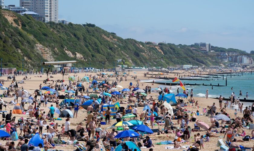 People enjoying the sunny weather on Bournemouth Beach in Dorset. Picture date: Sunday June 23, 2024.