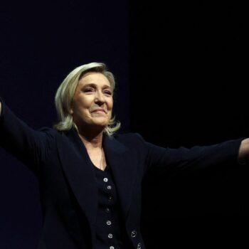 Marine Le Pen on stage in Henin-Beaumont after polls closed on Sunday. Pic: Reuters