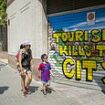 Now Barcelona joins Spain's war on tourists: Mayor pledges to drive AirBnb out of the city within five years after rents spiralled for locals