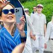 Queen Mary of Denmark takes photos of her son Crown Prince Christian as he sprays champagne from a party bus to celebrate his high school graduation