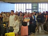 Travel hell at Manchester Airport after 'two-hour' power cut sparks chaos - with passengers left in the dark and stuck in huge queues with fears of mass flight delays