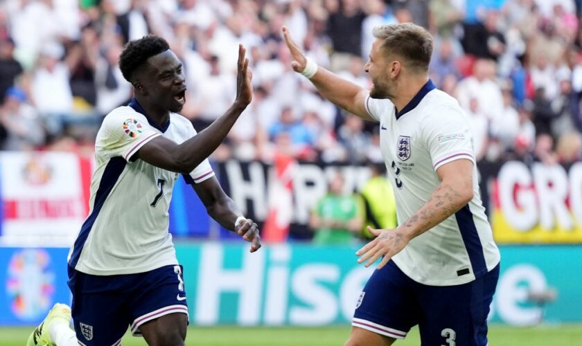 England's Bukayo Saka (left) celebrates with Luke Shaw during the quarter-final tie. Pic: PA