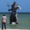 The 10ft-tall statue depicts the Greek god Poseidon appearing to rise from the sea. Pic: AP