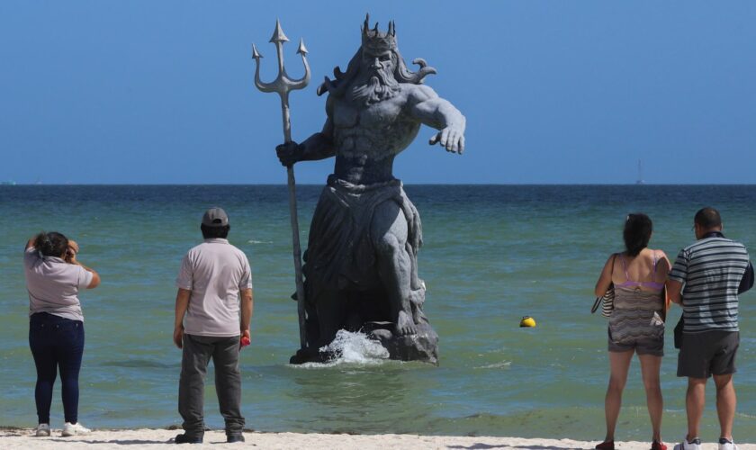 The 10ft-tall statue depicts the Greek god Poseidon appearing to rise from the sea. Pic: AP