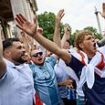 England fans get party started as huge crowds flood into central London: Police clash with boozing supporters who let off flares in Trafalgar Square - as pubs fill up across the country hours before kick-off