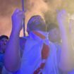 England fans cross their fingers and hope for victory in a fan zone in Berlin