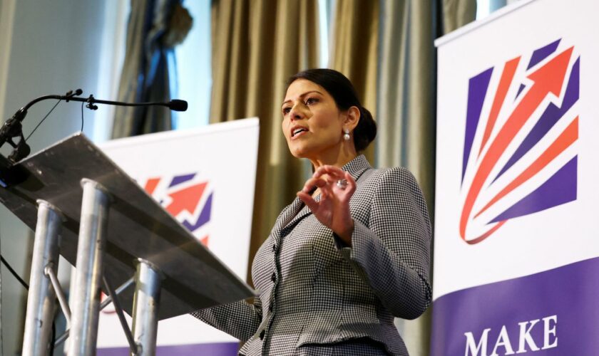 Priti Patel speaks on stage at the Britain's Conservative Party's annual conference in Manchester