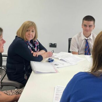 Wales's education secretary Lynne Neagle speaks with pupils at Whitmore High School in the Vale of Glamorgan