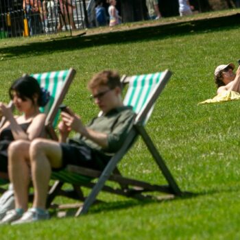 Sunbathers in Green Park, London. File pic: PA