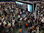 Microsoft outage travel chaos continues: Hundreds of frustrated travellers packed into Euston station with nowhere to go on day of disorder that saw more than 100 planes grounded and passengers stranded on hottest day of the year