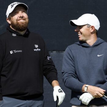 Open day three: Rory McIlroy supporting leader Shane Lowry after missing the cut