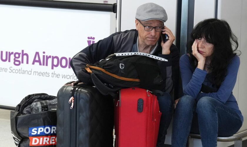 Passengers at Edinburgh Airport during the global IT outage on Friday. Pic: PA