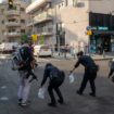 Israeli police investigate the scene of an explosive drone attack in Tel Aviv. Pic: AP