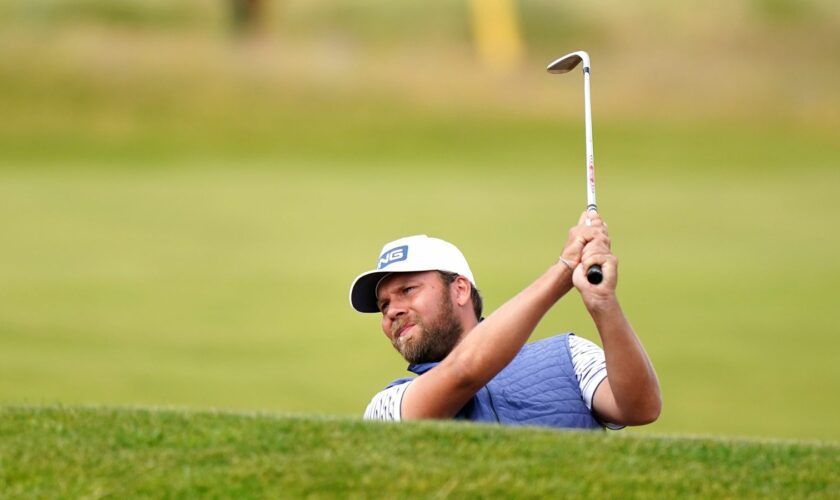 Dan Brown competes at The Open. Pic: PA