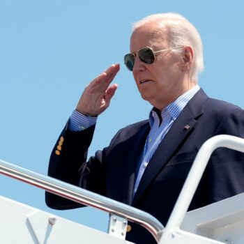 President Joe Biden salutes as he boards Air Force One at Andrews Air Force Base, Md., en route to a campaign trip in Madison, Wis., Friday, July 5, 2024. (AP Photo/Manuel Balce Ceneta)