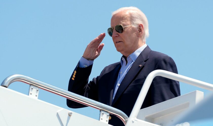 President Joe Biden salutes as he boards Air Force One at Andrews Air Force Base, Md., en route to a campaign trip in Madison, Wis., Friday, July 5, 2024. (AP Photo/Manuel Balce Ceneta)