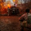 Ukrainian servicemen fire a D-30 howitzer towards Russian troops in Kherson. Pic: Reuters