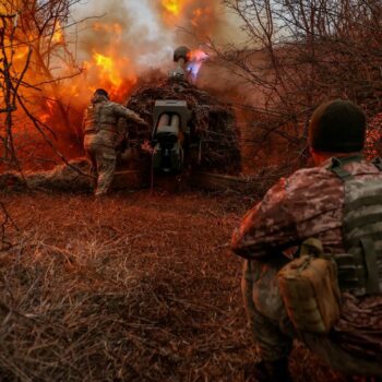 Ukrainian servicemen fire a D-30 howitzer towards Russian troops in Kherson. Pic: Reuters