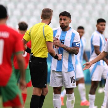 Referee Glenn Nyberg talks to Argentina's Nicolas Otamendi. Pic: Reuters