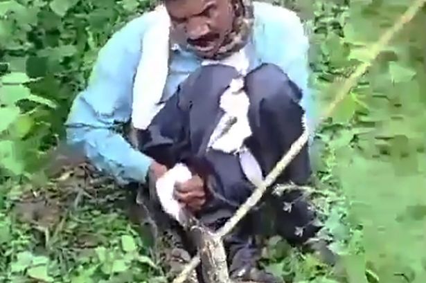 Horrifying moment giant python chokes man while going to loo in jungle