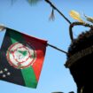 FILE - A performer in traditional dress stands before a welcome ceremony in Port Moresby, Papua New Guinea, Nov. 16, 2018. At least 26 people has been reported killed by a gang of men in three remote villages last week in Papua New Guinea's north, United Nations and police officials said on Wednesday, July 24, 2024. (AP Photo/Mark Schiefelbein, File)