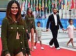 Chrissy Teigen leads the stylish celebs in khaki hot pants as she joins husband John Legend and children Luna, 8, and Miles, 6, at star-studded Olympics Opening Ceremony in Paris