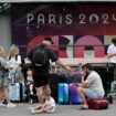 Travellers from Sydney, Australia, wait outside the Gare Montparnasse train station as they try to search for other trains after their trip was affected when vandals targeted France's high-speed train network with a series of coordinated actions that brought major disruption, ahead of the Paris 2024 Olympics opening ceremony, in Paris, France, July 26, 2024. REUTERS/Maye-E Wong TPX IMAGES OF THE DAY