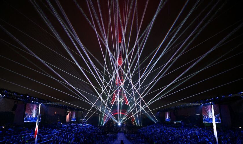 Olympics day one: Spotlight on sport after rain dampens unique opening ceremony