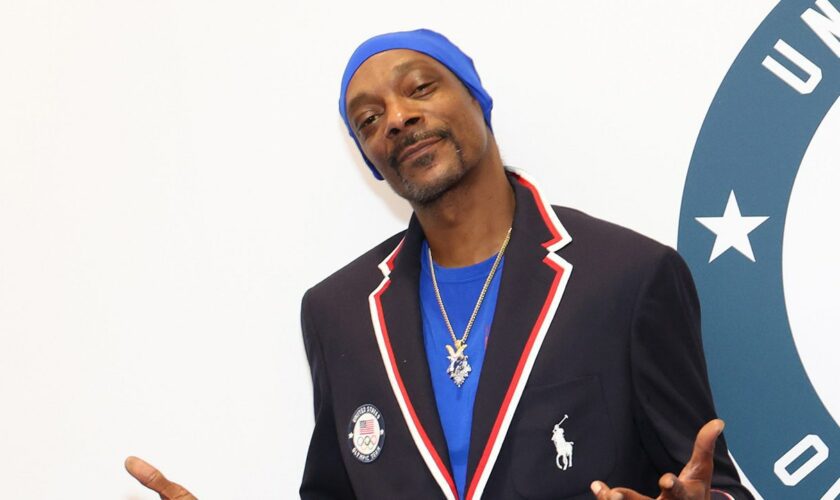 Snoop Dogg celebrates with US swimmer's wife during gold medal race in heartwarming moment