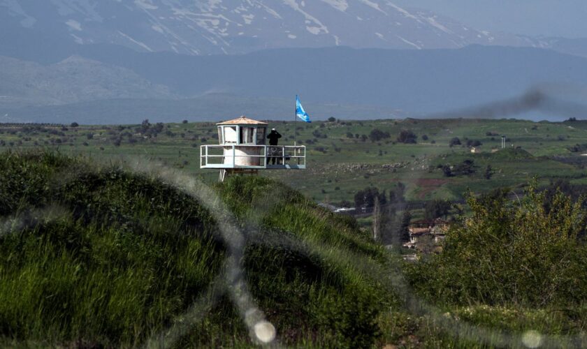 A U.N. peacekeeper guards at a post along the Israel-Syria border in the Israeli-occupied Golan Heights