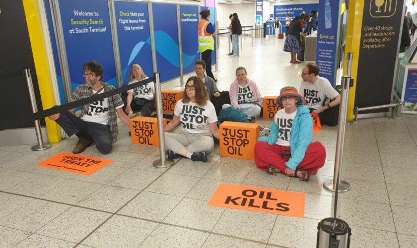 Just Stop Oil activists block departure gates at Gatwick airport