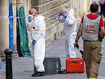 Bath emergency incident: Police crews in hazmat suits hose down shoppers in the street after 'a woman with a bag' left them unwell: Two are taken to hospital with breathing difficulties and itchy eyes amid five-hour city centre lockdown