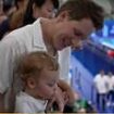 Moment Tom Daley is nearly soaked in fruit juice by his one-year-old son Phoenix after winning silver at the Paris Olympics