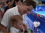 Moment Tom Daley is nearly soaked in fruit juice by his one-year-old son Phoenix after winning silver at the Paris Olympics