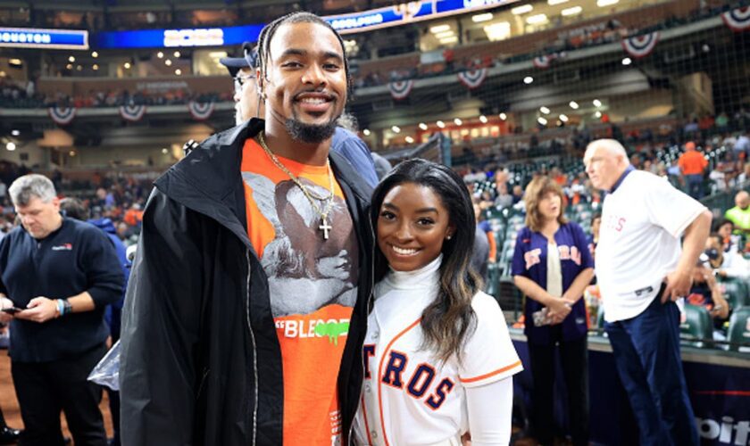 Simone Biles’ husband Jonathan Owens supports from the stands with her parents for women’s gymnastics team finals