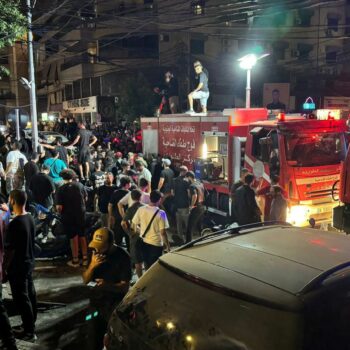 People gather near a site hit by what security sources said was a strike on Beirut's southern suburbs, Lebanon July 30, 2024. REUTERS/Mohamed Azakir