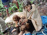 American woman is found chained to a tree and left to die in Indian jungle before local shepherd heard her shouts and saved her