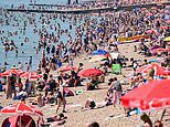 Brits bask in temperatures of 32C in hottest day of the year so far as Met Office issues official heatwave warning - but storms are on the way within hours