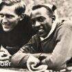 Luz Long and Jesse Owens pose at the side of the track at the 1936 Olympics in Berlin