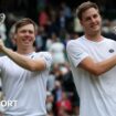 Harri Heliovaara and Henry Patten hold their Wimbledon doubles trophies