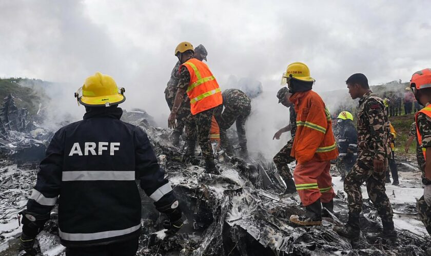 Plane slips off runway and crashes at Kathmandu airport, killing 18