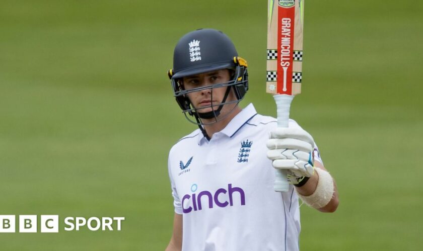 England wicketkeeper Jamie Smith raises his bat to salute the crowd at Edgbaston