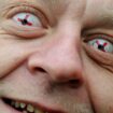 A member of English Defence League wears his patriotic contact lenses before the march into St George's Square, Luton in 2011