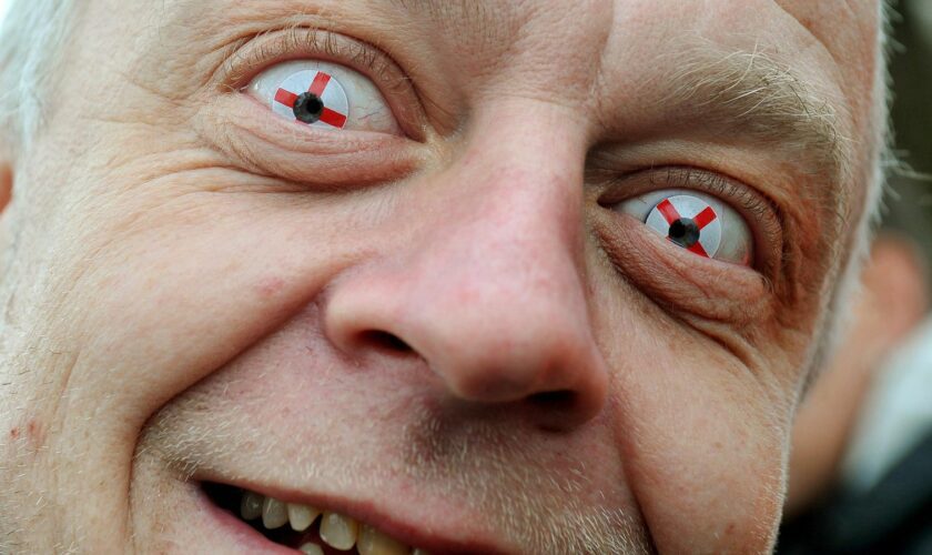 A member of English Defence League wears his patriotic contact lenses before the march into St George's Square, Luton in 2011